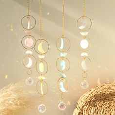 the sun shines brightly through the window and reflects in the glass beads hanging from the ceiling