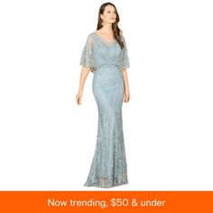 a woman in a blue dress with the words now trending, $ 50 & under