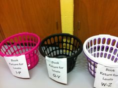 three baskets with labels on them sitting next to each other