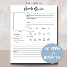 the printable book review sheet is shown in front of a marble background with a blue circle