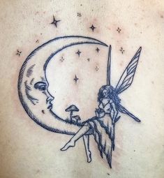 a woman with a fairy on her back holding the moon and sitting on it's side