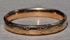 Signed Austin & Stone Gold Filled Floral Engraved Bangle Bracelet.  The bangle measures 7.5 inches in size  and features original floral engraving throughout.  The bracelet is signed Austin & Stone on the inside and is in great condition. Love this piece, but don't have the money to spend right now?  We offer FREE layaway on every item in our shop.  With just 20% down, take one full year (interest-free) to pay off your new jewelry!  There are no hidden fees or charges, ever.  For more informatio Heirloom Engraved Jewelry Bracelet, Classic Round Ceremonial Cuff Bracelet, Classic Round Cuff Bracelet For Ceremonial Occasions, Classic Gold Bangle With Intricate Design, Classic Gold Bangle Bracelet With Intricate Design, Formal Engraved Band Jewelry, Classic Bracelets With Decorative Band As Gift, Heirloom Bracelets With Intricate Design For Formal Occasions, Classic Ceremonial Bracelet With Intricate Design