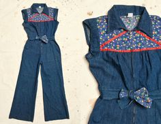 "1970s Denim Jumpsuit Dark Indigo with Floral Cotton Tie Front Bell Bottom Bohemian Jumpsuit W 30 Darling 70s denim jumpsuit. Dark blue denim with brass zipper to close the front. These are in beautiful condition, showing very minimal signs of wear. Marked as size 13. Measurements shoulder: 14\" chest: 38\" waist: 30\" hips: 42\" inseam: 31\" bell: 13.5\" top of shoulder to crotch seam: 31\"" Retro Fitted Denim Jumpsuit For Summer, Retro Cotton Fitted Jumpsuits And Rompers, Vintage Fitted Denim Jumpsuit For Summer, Vintage Cotton Fitted Denim Jumpsuit, Retro Fitted Denim Jumpsuit Overall, Retro Denim Jumpsuit For Summer, Fitted Blue Denim Retro Jumpsuit, Spring Vintage Fitted Denim Jumpsuit, Vintage Blue Jumpsuits And Rompers