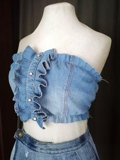 Step into the world of unique, fashionable, and sustainable fashion with our Denim Corset Crop Top, an upcycled chic casual wear that is a perfect blend of style and comfort. This stunning piece is not just a trendsetter but also a statement of your commitment to the environment. It's tailored from high-quality blue denim, designed with a stylish necktie that adds an extra touch of sophistication to the piece. This denim corset is a perfect gift for a fashion-forward woman who values sustainability and style. Avalable ison the pictures is light denim in size S and M from the size chart Lenght: 21 cm/ 8 in The denim skitrt also is available 95$. See it here: https://www.etsy.com/listing/1734456031/cute-mini-pleated-denim-skirt-reworked?click_key=b7731e961bd0e104aa2c0ca2de954785f5f23fcd%3A17 Denim Blue Patchwork Denim Top, Blue Upcycled Jeans For Summer, Upcycled Blue Jeans For Summer, Summer Patchwork Denim Vest, Denim Blue Vest For Festivals, Summer Denim Patchwork Vest, Denim Top For Festivals, Summer Denim Top With Patchwork, Blue Recycled Denim Top For Summer