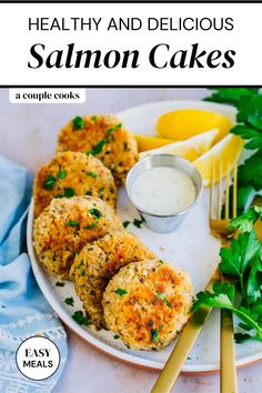 healthy and delicious salmon cakes on a white plate with lemon wedges next to it