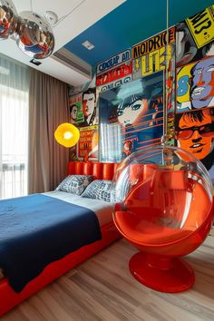 the bedroom is decorated in bright colors and features an orange chair, blue bedspread, and posters on the wall