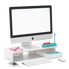 an apple desktop computer sitting on top of a desk next to a keyboard and mouse