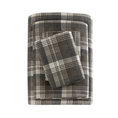 two gray and white plaid sheets on top of each other