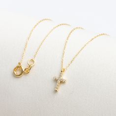 "Real Diamond Cross Necklace, 14K Solid Gold Small Cross Necklace, Diamond Minimalist Cross Necklace, Baptism Gift, Gold Religious Jewelry, Cross Necklace F E A T U R E S * Made to Order. * Gold KT: 14K * Choice of Gold Color: Yellow Gold, Rose Gold, White Gold * Gem Stone: Genuine Diamond * Diamond-Cut: Round * Diamond Carat: 0.05 ct. * Pendant Height: 10,00 mm / 0.39 inch * Pendant Width: 5,50 mm / 0.22 inch * Diamond Color-Clarity: G.VS Color, SI Clarity * Length: 14\", 16\", 18\", 20\", 22\", 24\" * Setting Type: Bezel Setting * Ready to Ship in 1-3 Business Days * 100% US sourced * 2 Years Warranty * Free Express International Shipping * Free returns within 14 days from the order date We loved making our jewelry with special designs for your special moments. Wishing you to share the j Dainty 14k Gold Jewelry For Baptism, Minimalist Gold Jewelry For Baptism, Yellow Gold Diamond Cross Necklace Gift, Dainty Gold Cross Necklace For Baptism, Gold Cross Pendant Jewelry For Baptism, Elegant Gold-tone Cross Necklace, Yellow Gold Baptism Cross Pendant Necklace, Necklace Photography, Cross Accessories