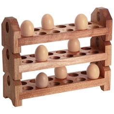 an egg rack with six eggs in it and one on the other side, made out of wood