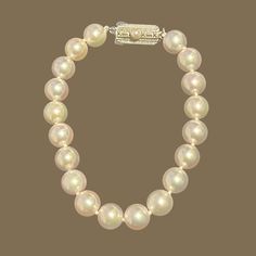 Authentic Mikimoto Estate Akoya Pearl Bracelet 7.25" Sterling Silver 8.5 - 8 mm M398This elegant Authentic Mikimoto Estate Akoya pearl bracelet is made of 19 Japanese Akoya pearls with a sterling silver clasp. TRUSTED SELLER SINCE 2002PLEASE SEE OUR HUNDREDS OF POSITIVE FEEDBACKS FROM OUR CLIENTS!!FREE SHIPPINGDETAILS19 Fine Quality Japanese Akoya PearlMeasurements: 8.5 - 8 mm mm ApproxLength: 7.25 InchesMaterial: Sterling Silver This Mikimoto Japanese Akoya Pearl Bracelet has a silver clasp whi Formal Pearl Bracelets With Round Beads, Classic Pearl Chain Bracelet, Classic Gold Bracelet With Pearl Charm, Classic White Gold Pearl Bracelet With Charm, Classic Gold Pearl Jubilee Bracelet, Formal Pearl White Jubilee Bracelet, Classic White Gold Akoya Pearl Bracelet, Classic Pearl Bracelet With Round Beads, Timeless Formal Akoya Pearl Bracelets