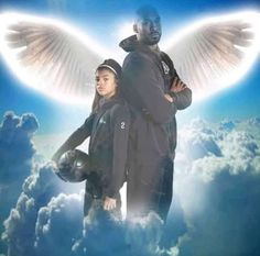 two people are standing in the clouds with an angel wings on their shoulders and arms