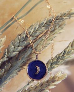 A sweet blue & gold moon pendant hangs from a soft gold chain. Color: Gold & blue Length: 18"-20" total Pendant width: 1" Blue Moon Charm Necklaces For Gifts, Blue Moon Charm Necklace For Gift, Blue Moon Charm Necklace Gift, Blue Gold-plated Charm Necklace With Adjustable Chain, Blue Moon Charm Pendant Necklace, Blue Celestial Necklaces With Sun And Moon Design, Celestial Blue Necklaces, Celestial Blue Round Necklaces, Blue Celestial Round Necklaces