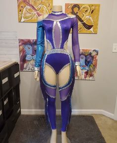 a female mannequin dressed in purple and blue