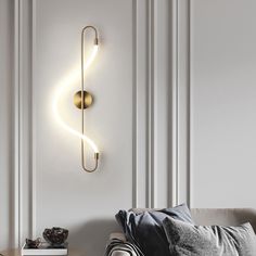 a living room with a couch and a wall light