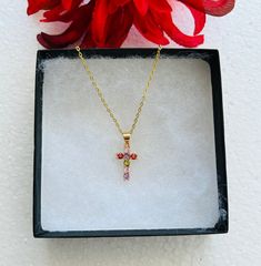 **A beautiful Dainty Cross Cubic Zirconia stones birthstone charm necklace with  gold-filled chain. Perfect for a birthday ** 16 Gold Filled chain** 5x4mm CZ Cross Pendant ** A friendly reminder in taking care of the chain - the chain will fade if exposed in water, chemicals, perfume, or even sometimes perspiration ** Gold Cubic Zirconia Necklace For Birthday, Cross-shaped Birthstone Necklaces As Gifts, Cross Necklace With Birthstone For Gift, Cross-shaped Birthstone Necklace For Gift, Pink Cross Pendant Necklace For Gift, Gold Crystal Birthstone Necklaces As Gift For Her, Cubic Zirconia Cross Pendant Necklace As A Gift, May Birthstone Cross Pendant Jewelry Gift, Gold Pendant Birthstone Necklace For Birthday