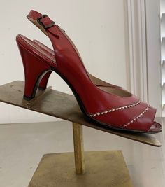 "Very pretty 50's Dark Red & White Leather peep toe sling back heels by \"Troylings\" Seymour Troy size 7N. These have a double row White Diamond pattern across the front and have an adjustable buckle back. They are in excellent vintage condition with general wear consistent with their age and some minor small scuffs. They are in ready to wear condition. Really cute design and great with a Red outfit! The pictures are part of the items description and show condition. Please use the zoom feat Vintage Red Heels For Spring, Vintage Slingback Heels For Spring, Vintage Slingback Pumps For Formal Occasions, Vintage Pointed Toe Slingback Pumps For Summer, Vintage Slingback Pumps With Pointed Toe, Fitted Vintage Heels For Summer, Fitted Vintage Summer Heels, Vintage High Heel Slingback Pumps For Summer, Vintage High Heel Slingback Pumps