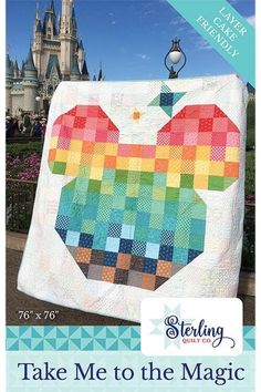 an apple quilt is displayed in front of a castle with the words take me to the magic kingdom on it