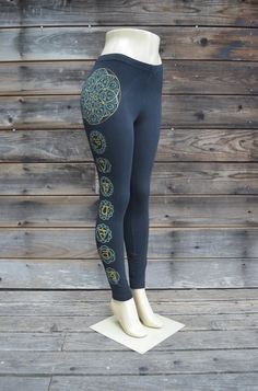 Glow in the Dark Seed of Life Chakra Leggings - Women's Sacred Geometry Clothing These comfortable black cotton/spandex leggings feature my metallic gold and glow in the dark Seed of Life Chakra design. The outside of the right leg is decorated with a double layer screen print of my hand drawn Seed of Life mandala printed in glow in the dark ink, with a gold Seed of Life image over it. Under this design is a similar double layer screen print of the Chakras, with all of the mandalas printed in gl Cotton Yoga Leggings, Black Full-length Cotton Leggings, Black Full Length Cotton Leggings, Full-length Black Cotton Leggings, Full Length Black Cotton Leggings, Cotton Full-length Leggings For Yoga, Black Cotton Yoga Leggings, Black Cotton Yoga Pants For Workout, Black Cotton Yoga Bottoms