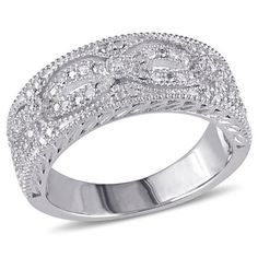 a white gold ring with diamonds on the sides and an intricate design in the middle