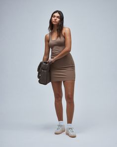 Tank-style fitted mini dress with a scoop neck and racerback finish. 95% Cotton/5% SpandexUnlinedMini lengthRacerback Classic scoop neckFit: True to size. Model Sonya is 5'8 and wearing a size X-Small. Fabric Care: Machine wash cold, tumble dry low or hang dry. Do not bleach. Designed in LA; Imported.