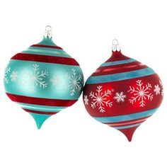 two red and blue ornaments with snowflakes on them