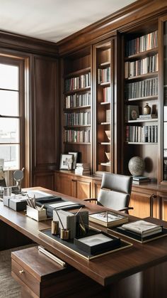 a large wooden desk with many books on it