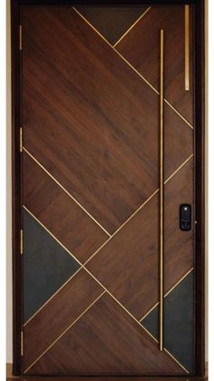 a wooden door with gold trim and an arrow design on the bottom half of it