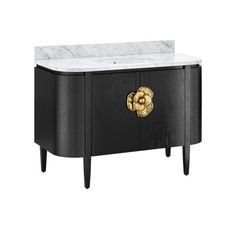 a black cabinet with marble top and gold accents on the front, against a white background