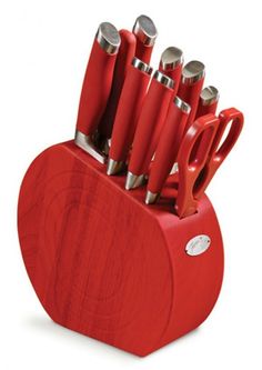 a red knife holder with many knives in it