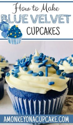 blue velvet cupcakes with white frosting and sprinkles