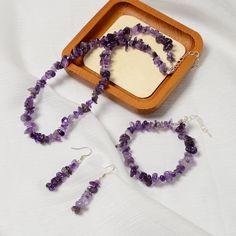 Check out our Coupon Codes Below! Material: Natural Amethyst ( Not Treated or Dyed ) Shape: Chips  Color: Purple Beads Size:  Approx 5-8mm Earrings - Approx 10 Beads 1.5" Length Per Piece Bracelet - Approx 60 Beads 7''-8.5" Length  Per Piece Adjustable Necklace - Approx 145 Beads 16''-17.5" Length Per Piece Adjustable Sold by Set  with Bracelet, Earrings and Necklace Per Set Packing Box NOT included Mined in South Africa Note:  -Gemstone bead sizes are approximate and may have a +/- 0.5mm differ Set Bracelet, Bead Sizes, Jewerly Making, Purple Beads, Earrings And Necklace, Chip Beads, Adjustable Necklace, Bracelets And Charms, Precious Gemstones