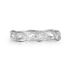 a white gold wedding band with leaves and diamonds