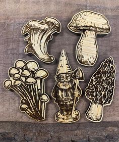 wooden cutouts of mushrooms and gnomes on a piece of wood