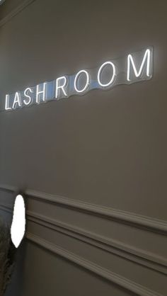 a room with a sign that says lashroom on the wall