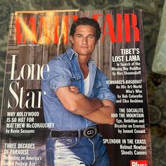 a magazine cover with a man in jeans on the front and an image of his arms crossed