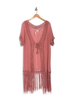 Ideal for layering, this short sleeved kimono features a simple tie front design and a tonal fringed trim. No collar. Short sleeves. Tie front. Fringe trim. Approx. 41" length (size S). ImportedThis item cannot be shipped to Canada. Summer Short Sleeve Tops With Tassels, Summer Tassel Short Sleeve Tops, Casual Short Sleeve Tops With Tassels, Summer Fringe Tops With Short Sleeves, Summer Short Sleeve Fringe Top, Summer Fringe Short Sleeve Top, Spring Short Sleeve Tops With Fringe, Casual Short Sleeve Cover-up For Festival, Casual Spring Short Sleeve Cover-up