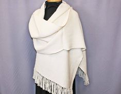 "This luxurious hand woven alpaca shawl is the perfect accessory for any season.  It is soft, but warm enough for a cool spring evening or for cuddle by a winter fire.  This elegant piece would make a wonderful wedding wrap.  It measures a generous 84\" long by 17.5\" wide, enough to wrap you in snuggly softness.  Hand wash in gentle soap and dry flat.  A warm iron may be used." Handwoven Alpaca Shawl, White Pashmina Shawl Scarf, Elegant Alpaca Shawl Scarves, Elegant Alpaca Shawl, Bohemian White Pashmina Shawl For Wedding, White Bohemian Pashmina Shawl For Wedding, Elegant Alpaca Shawl Scarf, Elegant Alpaca Shawl One Size, White Shawl Wrap Scarf