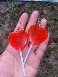 "Cute BIG, HEART + LOLLIPOP earrings. Colors are red and gold. Has a little bit of scratches. sold as is. Style: Hipster, punk, Kitsch, goth, gothic, punk, Kawaii, Boho, Hippie, Retro. For pierced ears. Perfect for Valentines and Halloween. Great Birthday gift. approximate measurements: body of earrings: 3\" L x 1 3/8\"W drop of earrings: 3 3/4\" L" Trendy Red Dangle Heart Earrings, Sweet Red Jewelry For Valentine's Day, Red Heart Charm Earrings For Party, Red Dangle Heart Earrings For Party, Trendy Red Heart Earrings For Valentine's Day, Red Handmade Heart Earrings For Party, Cute Handmade Red Heart Earrings, Trendy Red Heart Earrings For Gift, Handmade Red Sweet Earrings