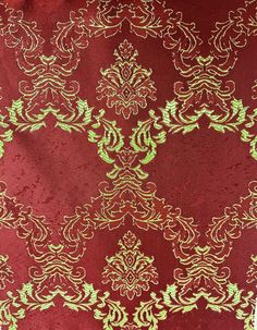 a red and green fabric with gold designs on it