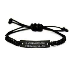 a black bracelet with an inspirational quote on the front and back, that says'all men are created equal but the finest become a true value