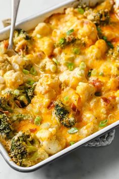 a casserole dish with broccoli, cauliflower and cheese