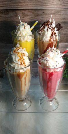 three ice cream sundaes with different toppings