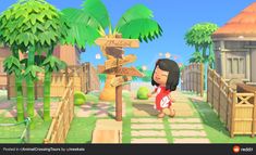 an animal crossing game with a girl walking towards the sign and palm trees in the background