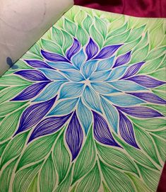 a drawing of a blue and green flower