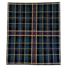 a black and blue plaid rug on a white background