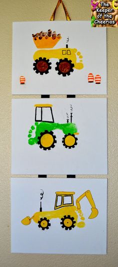 three pictures with construction vehicles painted on them hanging from the wall in front of a door