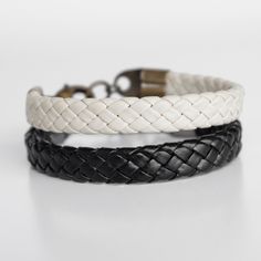 "Men's Leather Bracelet Set, Men's Black & White Bracelets, Men's Leather Jewelry, Men's Gift, Boyfriend Gift, Husband Gift, Guys Bracelet. Bracelet set for Men in two colours: Black & White.  It is very fashionable to wear them together. This men's bracelets are made of braided cream white leather and braided black leather with lobster clasp.  The bracelets comes with 2\" extension chain. Colors can be slightly different from the photo     For more jewellery & accessories check this : www.etsy. Classic Black Leather Bracelet Gift, Luxury Black Leather Bracelet Gift, Black And White Bracelets, Masculine Black Adjustable Bracelets, Mens Leather Jewelry, Masculine Black Leather Bracelet With Stainless Steel, Men's Leather Bracelet, Mens Bracelet Black, Gift Boyfriend