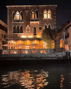 a large building sitting next to a body of water