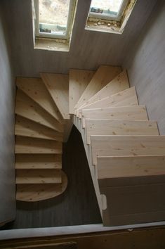 the stairs are made from plywood and have windows above them